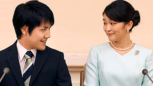 1 Princess Mako, the elder daughter of Prince Akishino and Princess Kiko, and her fiancee Kei Komuro, a university friend of Princess Mako, smile during a press conference to announce their engagement at Akasaka East Residence in Tokyo